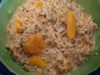 Overhead of Soaked Oats in Green Bowl topped with mango