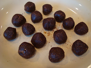 Overhead of Raw Vegan Chocolate Donut Holes on white plate