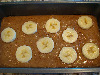 Batter poured into loaf pan and topped with sliced bananas