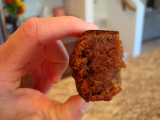 Hand holding up a slice of the Vegan Banana Bread
