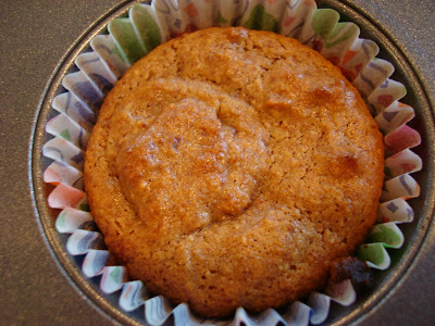 Close up of one Vegan GF Banana Nut Muffin in paper liner