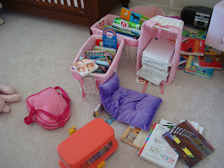 Childs room showing a mess of items on floor