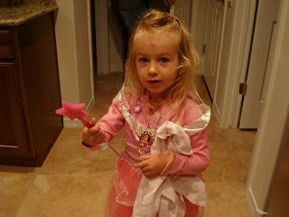 Young girl in fairy princess costume holding wand