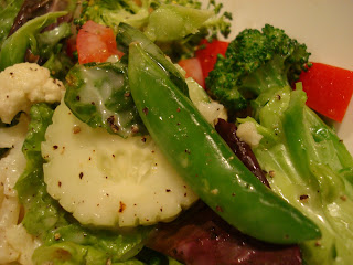 Close up of Raw Vegan Sugar Snap Pea Salad with (Raw) Vegan Creamy Tahini Dressing