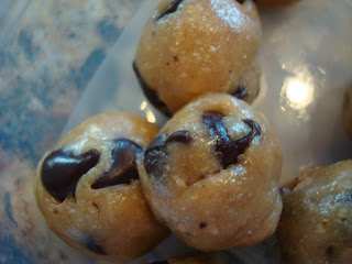 Close up of three Raw Vegan Chocolate Chip Cookie Dough Balls