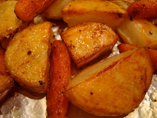 Close up of cooked red and yukon gold potatoes and baby carrots