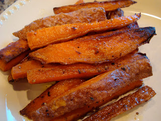 White plate with Roasted Sweet Potato Fries layered on top of one another