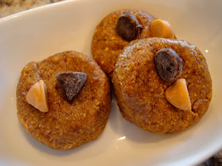 Close up of three Raw Vegan Almond Butter Cookie Bites on white dish