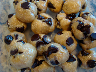 Overhead of Raw Vegan Chocolate Chip Cookie Dough Balls in clear container