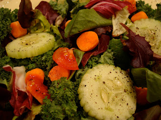 Mixed green salad with sliced vegetables