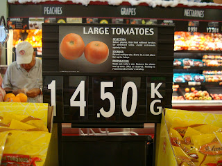 Sign for Tomatoes with price in Aruba 