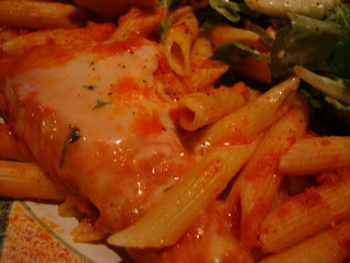 Closeup of chicken parmesan and pasta