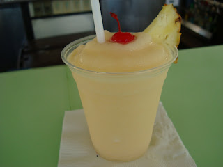 Pina Colada with cherry and slice of pineapple