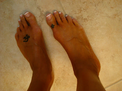 Two feet showing fresh spray tan