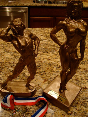 Two trophies on countertop