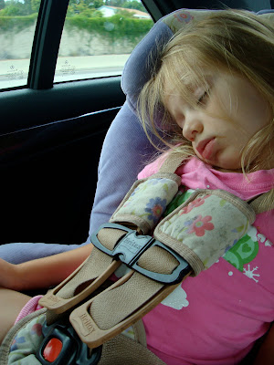 Young girl in car seat sleeping