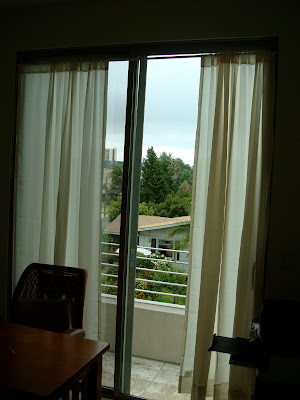Open curtain on windows in room
