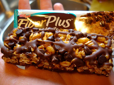 Fiber Plus Bar out of packaging showing chocolate chips and drizzle