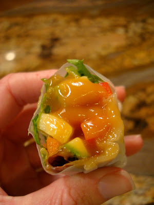 Inside spring roll dipped in Peanut Sauce