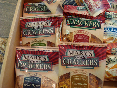 Box full of bags of Mary's Crackers