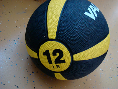Side view showing 12 LB on Medicine Ball
