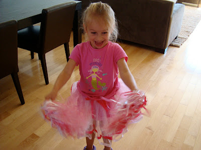 Young girl wearing pink and white tutu