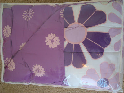 Purple and white bedding with flowers