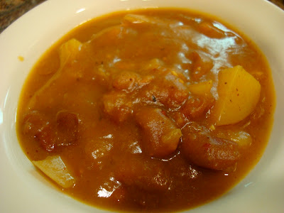 Close up of of Savory Pumpkin, Potato, & Carrot Soup in white bowl