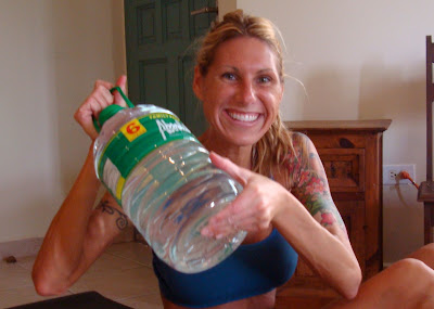 Woman holding large jug of water