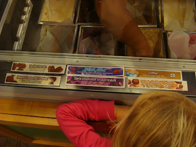 Young girl overlooking ice cream counter