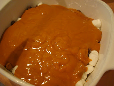 Peanut butter mixture poured over marshmallows