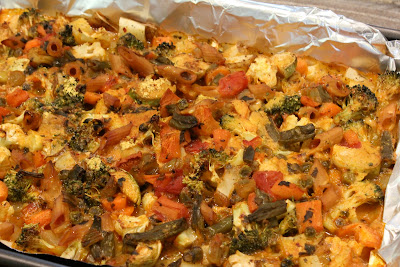 Side view of Cheezy Vegetable Bake on foil lined pan