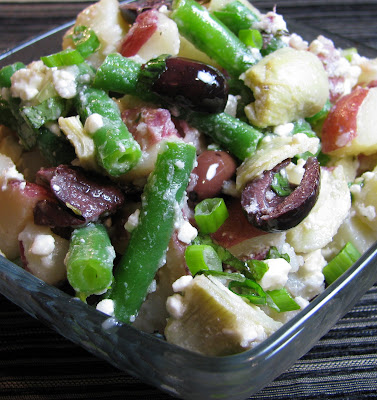 potato salad with artichokes, green beans, olives and feta
