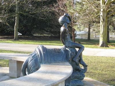 Statue of boy on elephant in the park