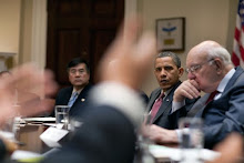 Barak Obama listens