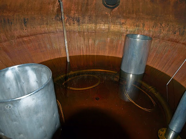 inside a still at Glen Scotia Distillery showing the steam heating pots