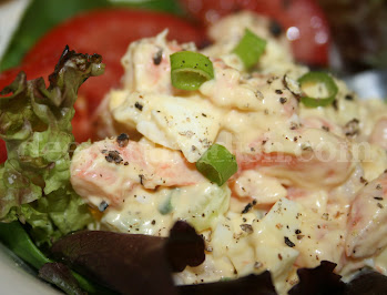 A favorite egg salad, made very simply with the addition of shrimp, green onion, celery and mayonnaise. Serve with crackers, as a sandwich, or stuffed into a tomato. Light and delicious!