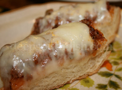 French bread, topped with a mixture of ground beef, onion, bell pepper, Parmesan cheese & pizza sauce, and topped with mozzarella cheese for gooey goodness!