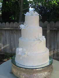 4-tier round fondant with sugar crystals and gumpaste flowers