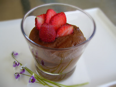 chocolate mousse in a glass with strawberries slices