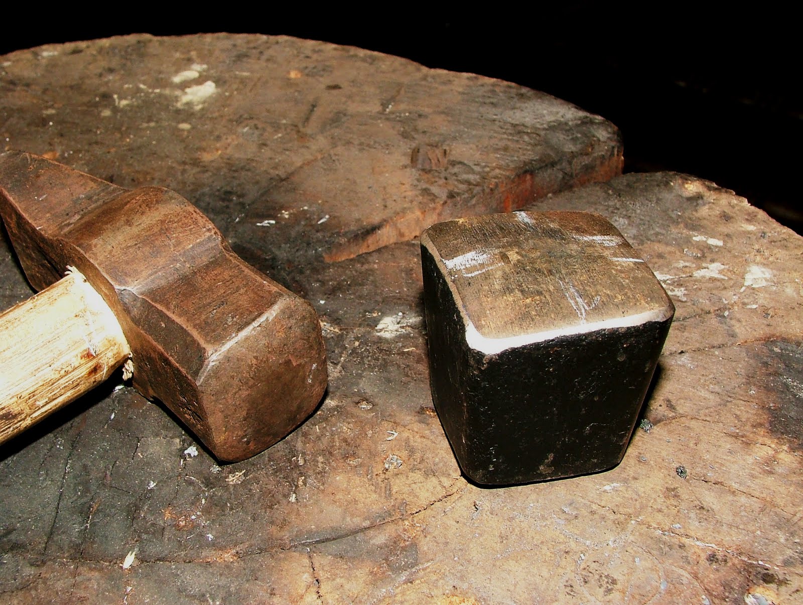 Rural Blacksmith Sharpening the Scythe by hammer and stone.