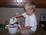 Mason helping make cupcakes