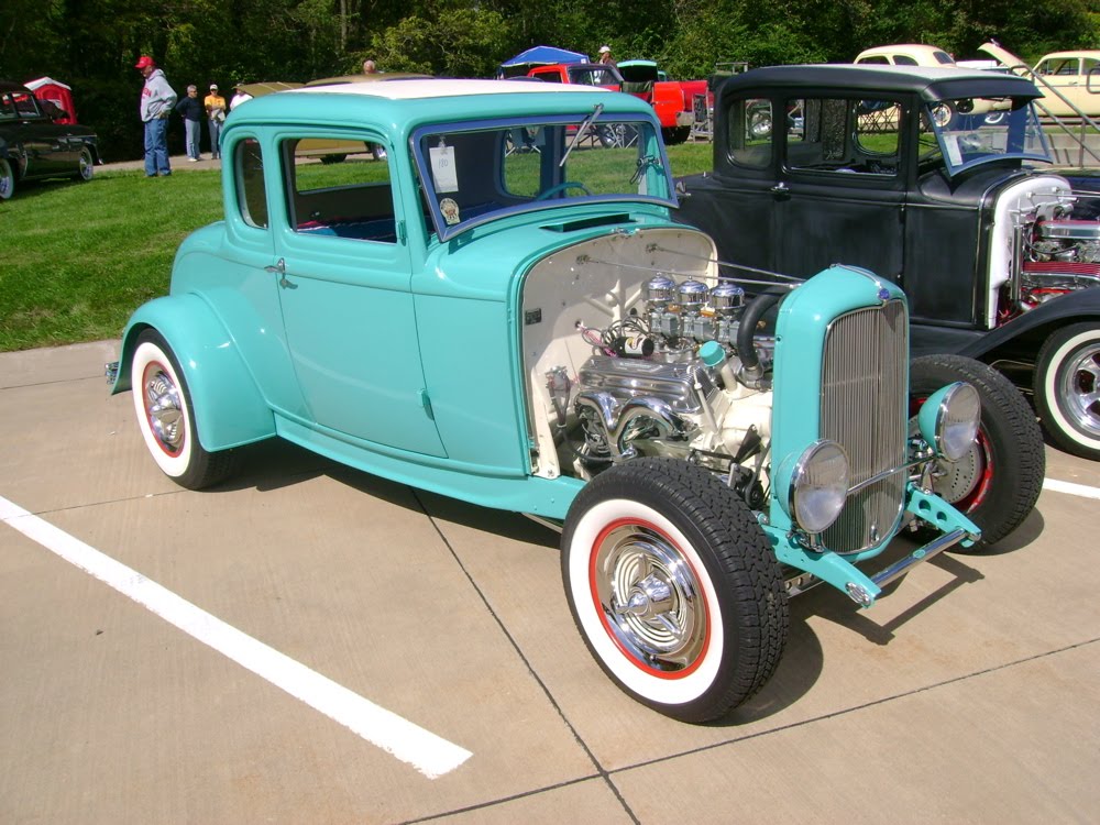 blue, gold, and green 2010 Quad City Vintage Rods car show