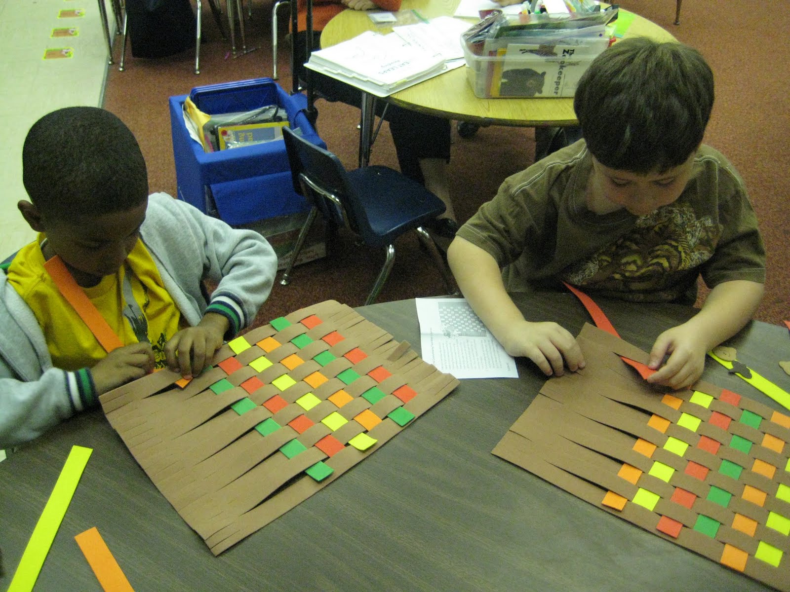 First Grade with Mrs. Ledford and Mrs. Vaillette Making Placemats
