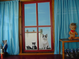 gatitos en la ventana