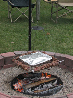 Automatic chef rotating campfire grill