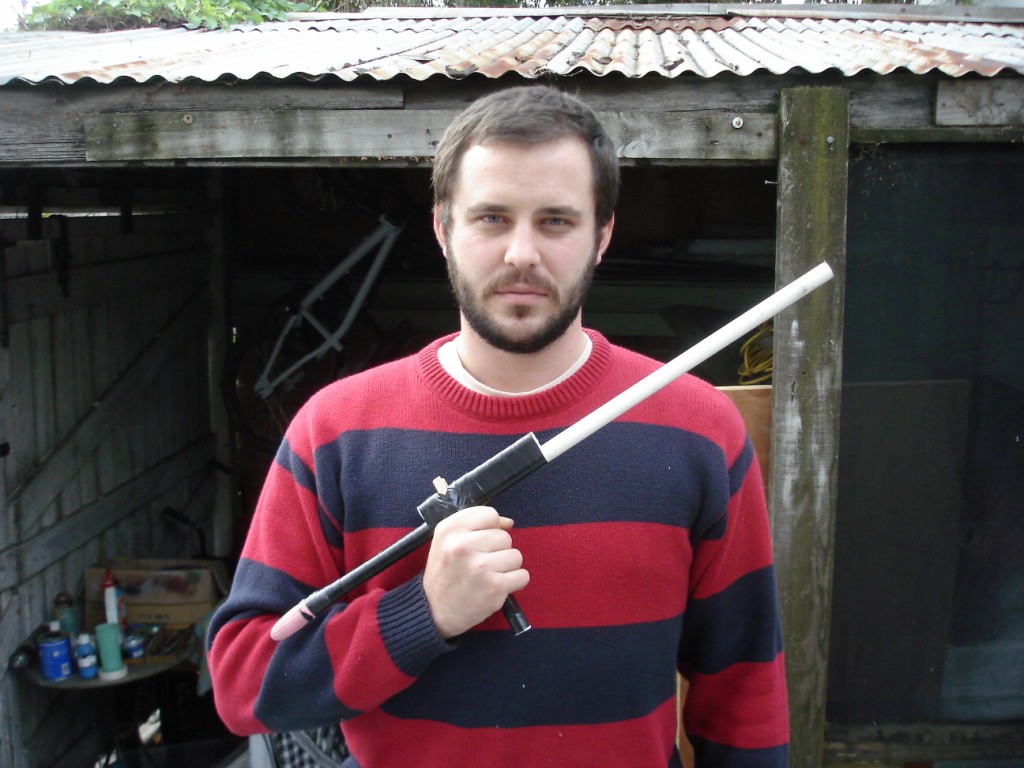 [posing+with+glove+gun.JPG]
