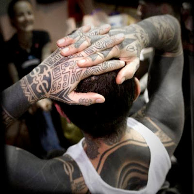 Maori black body tattoo on a