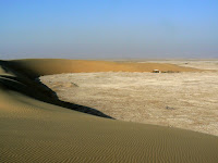 Sand dunes form a semi-circle