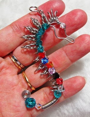 holding the wire wrapped spiky seahorse pendant